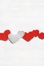 Valentines day concept, knit hearts valentine, handmade red crochet heart on white wooden table, diy gift for romance