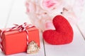 Valentines day concept. Red gift box with red heart and flower Royalty Free Stock Photo
