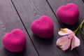 Valentines day concept. Three pink heart velvet cakes on a wooden black background with a delicate Alstroemeria flowers Royalty Free Stock Photo