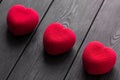 Valentines day concept. Three Red heart velvet cakes on a wooden black background Royalty Free Stock Photo