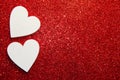 Valentines day concept. White decorative Hearts on red shiny background with copy space. Shiny sparkle metallic glitter texture. Royalty Free Stock Photo