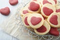 Valentines day cookies. Shortbread cookies inside a sweet red heart on parchment paper on white background. Mothers day. Womans Royalty Free Stock Photo