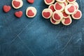 Valentines day cookies. Shortbread cookies inside a sweet red heart on parchment paper on dark blue background. Mothers day. Woman Royalty Free Stock Photo