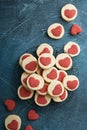 Valentines day cookies. Shortbread cookies inside a sweet red heart on parchment paper on dark blue background. Mothers day. Woman Royalty Free Stock Photo