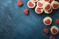 Valentines day cookies. Shortbread cookies inside a sweet red heart on parchment paper on dark blue background. Mothers day. Royalty Free Stock Photo