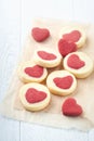 Valentines day cookies. Shortbread cookies inside a sweet red heart on parchment paper on white background. Mothers day. Womans Royalty Free Stock Photo