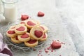 Valentines day cookies. Shortbread cookies inside a sweet red heart on pink plate on grey background. Mothers day. Womans day. Swe Royalty Free Stock Photo