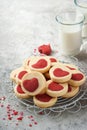 Valentines day cookies. Shortbread cookies inside a sweet red heart on pink plate on grey background. Mothers day. Womans day. Swe Royalty Free Stock Photo