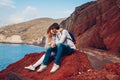 Valentines day. Couple in love enjoying honeymoon on Red beach in Santorini island, Greece. Vacation and traveling Royalty Free Stock Photo
