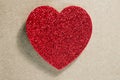 Valentines day dark red Red heart with light background.Sparkling glittering red heart,maroon,burgundy color on brown paper.Vintag