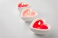 Heart shaped candles burning on valentines day