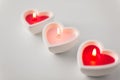 Heart shaped candles burning on valentines day