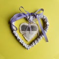 Valentines day.Decorative heart with a lavender inside another heart made of wood
