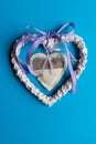 Valentines day.Decorative heart with a lavender inside another heart made of wood