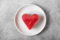 Valentines day dessert. heart shaped raw vegan cake in a plate. healthy delicious food. top view