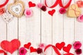 Valentines Day double border of hearts, flowers, gifts and decor on white wood