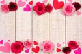 Valentines Day double border of hearts and roses against rustic white wood