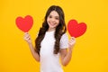 Valentines Day. Dreaming cute teen child with red heart. Happy teenager, positive and smiling emotions of teen girl. Royalty Free Stock Photo