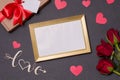 Valentines day,empty frame,love,black background,gift,red roses,hearts,message,free copy text space Royalty Free Stock Photo