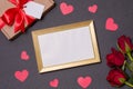 Valentines day,empty frame,black background, gift,red roses,hearts,message,free copy text space Royalty Free Stock Photo