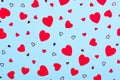 Valentines Day festive pattern. Red hearts on baby blue background