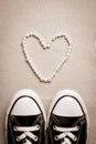 Valentines day flat lay banner. Chucks and pearls female concept. Royalty Free Stock Photo