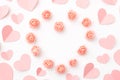 Valentines Day floral background with coral or pink flowers rose shape heart, hearts flat lay. Mothers day, 8 March Women day. Royalty Free Stock Photo