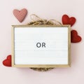 Valentines Day frame of wooden hearts and paper roses on a background with copy space. Royalty Free Stock Photo