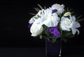 Valentines Day Funeral Bouquet purple White flowers, Sympathy and Condolence Concept on blackbackground Royalty Free Stock Photo