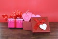 Valentines day gift box red and pink on wood background and pink Heart in box Love concept Royalty Free Stock Photo