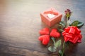 Valentines day gift box red on wood background / Romantic red Heart Valentines day red rose flower Royalty Free Stock Photo