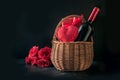 Valentines day gift hamper, bouquet of red roses, bottle of sparkling wine on black Royalty Free Stock Photo