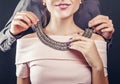 Valentines day gift. Man helping his girlfriend to try on gem necklace. Romantic present for holiday. Love couple Royalty Free Stock Photo