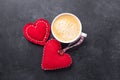 Valentines day greeting card. Coffee cup and decorative textile hearts on stone background. Top view Royalty Free Stock Photo