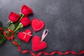 Valentines day greeting card. Red roses and textile hearts on stone background. Top view Royalty Free Stock Photo