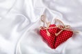 Valentines day. Hand made valentine heart. Wedding day. Red valentines hearts on white satin. Text: I love you Royalty Free Stock Photo