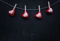 Valentines Day. Heart hanging on rope black wooden blackground Royalty Free Stock Photo