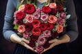 valentines day heart made of multicolor roses in hands