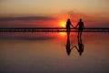 Valentines day. Heterosexual couple in love, silhouette of romantic young man and woman holding hands enjoying sea Royalty Free Stock Photo