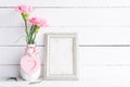 Valentines Day And Love Concept. Pink Carnation Flower In Vase With Old Vintage Picture Frame And Red Heart And On White