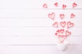 Valentines day and love concept. Red paper hearts splash out from white coffee cup Royalty Free Stock Photo