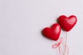 Valentines day and love concept. Two handmade red hearts with red ribbon on white wooden background Royalty Free Stock Photo