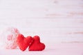 Valentines day and love concept. Two red hearts with pink rose flower on white wooden background Royalty Free Stock Photo