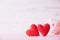 Valentines day and love concept. Two red hearts with pink rose flower on white wooden background Royalty Free Stock Photo