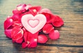 Valentines day love heart romantic concept / Pile of roses petals with pink heart decorated Royalty Free Stock Photo