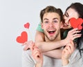 Valentines day and love. Man and woman couple in love hold red heart valentines cards white background. Valentines day Royalty Free Stock Photo