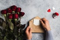 Valentines day man hand holding envelope love letter with greeting card Royalty Free Stock Photo