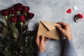 Valentines day man hand holding envelope love letter with greeting card Royalty Free Stock Photo