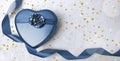 Blue heart gift box with curl ribbon on white background. Royalty Free Stock Photo
