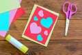 Valentines day or Mothers day postcard with pink and blue hearts. Scissors, glue stick, colored paper sheets set